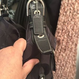 Coach black woman hand bag. Adjustable straps.